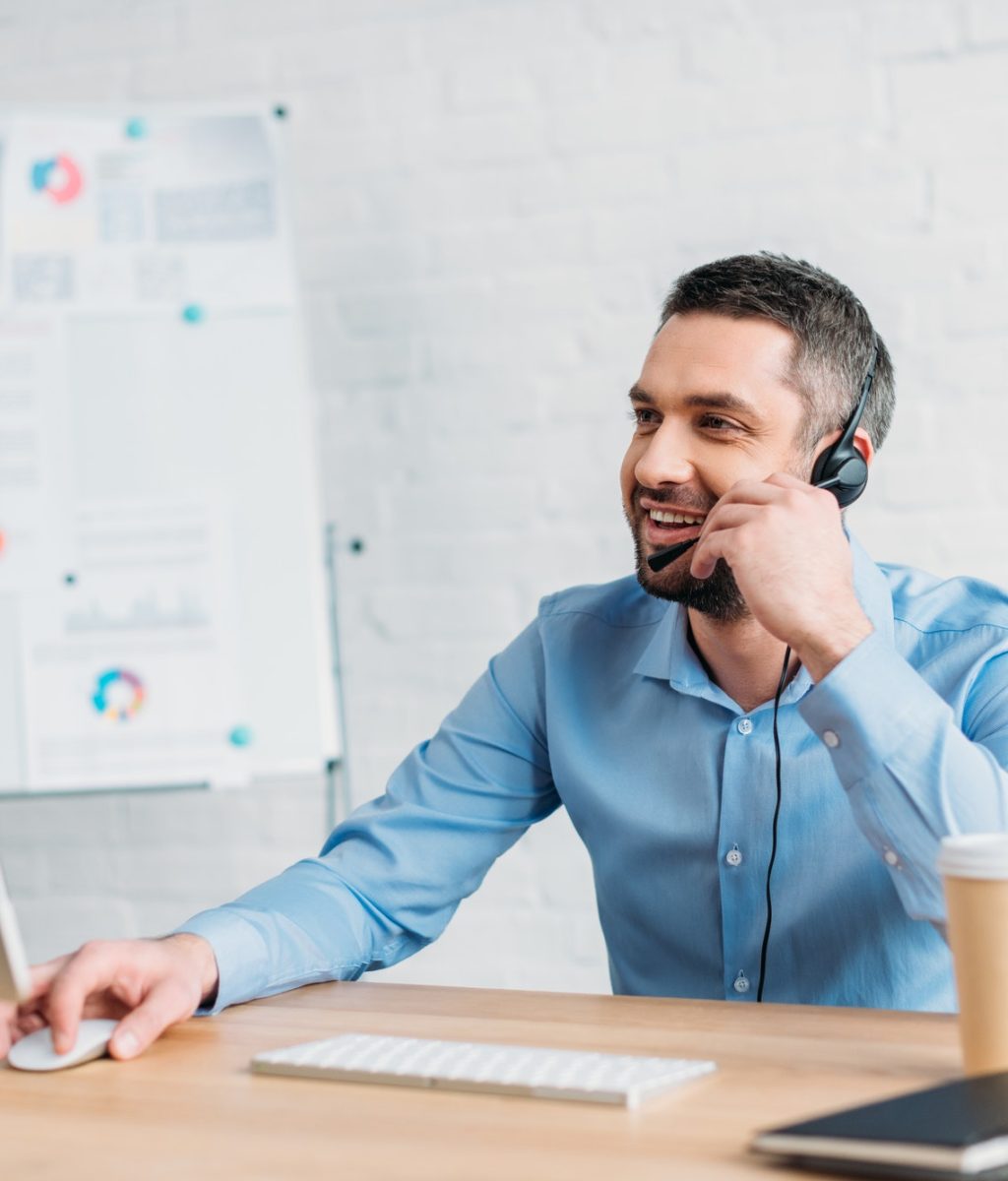happy-adult-call-center-worker-working-at-office